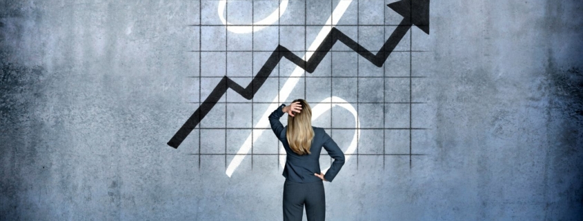Woman looking at rising interest rates